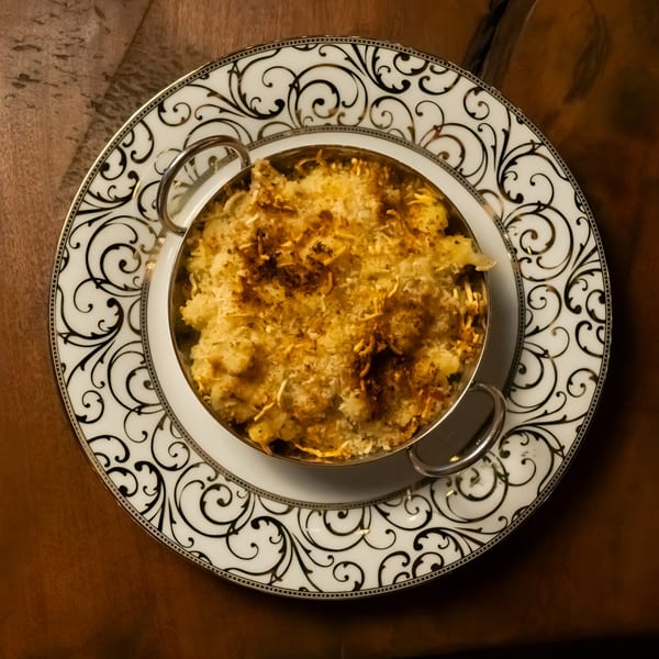 Starlite Restaurant and Bar's mac and cheese in a metal bowl on a decorative plate.