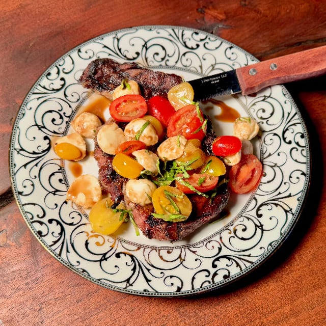 Grilled Ribeye Steak Caprese Style.