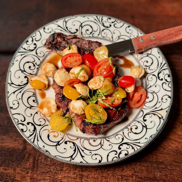 Grilled Ribeye Steak Caprese Style.